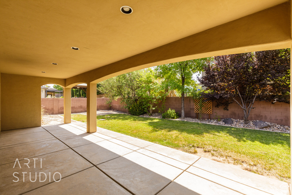Fenced backyard with a patio area