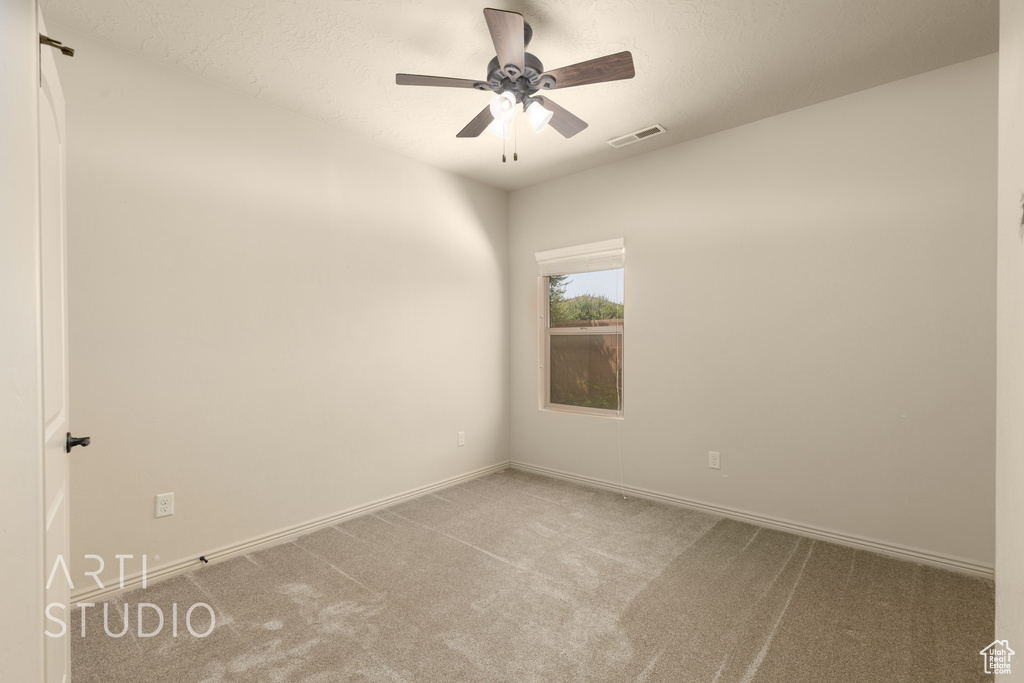 Unfurnished room with carpet floors and ceiling fan