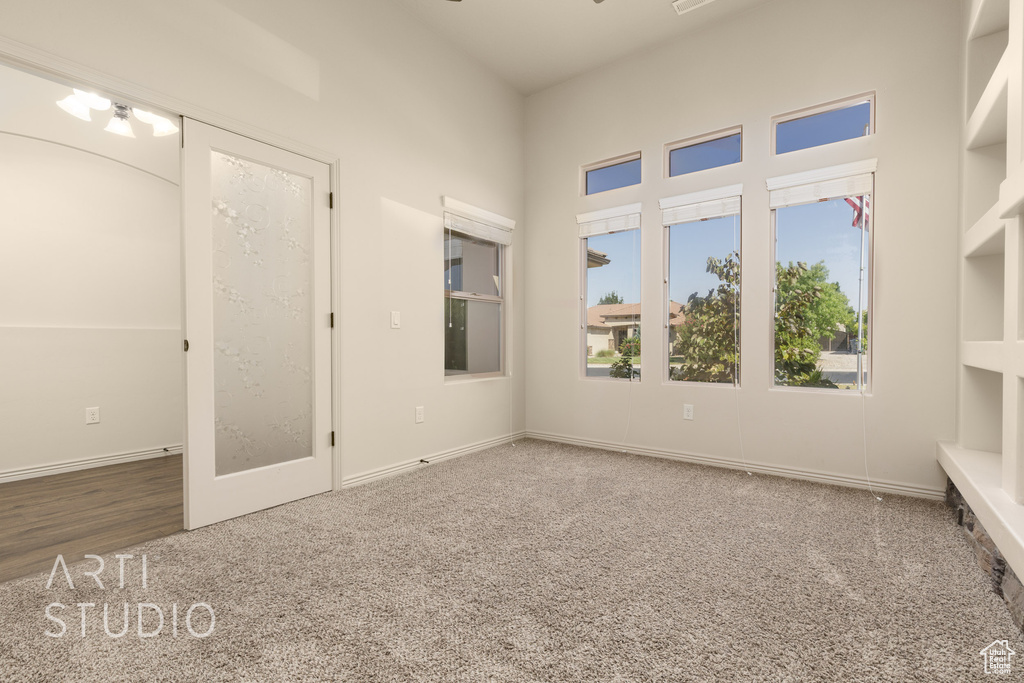Unfurnished bedroom featuring carpet flooring and baseboards