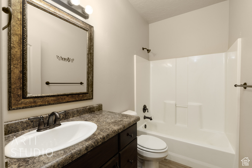 Bathroom with vanity and shower / bath combination