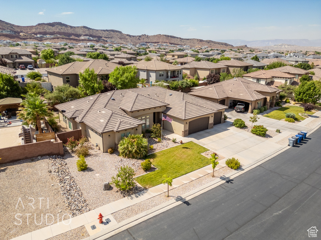 Aerial view of residential area featuring mountains