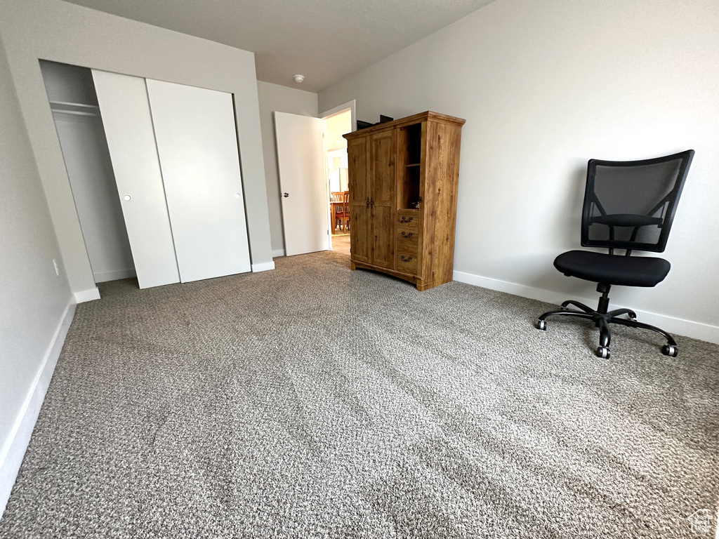 Bedroom with a closet and carpet