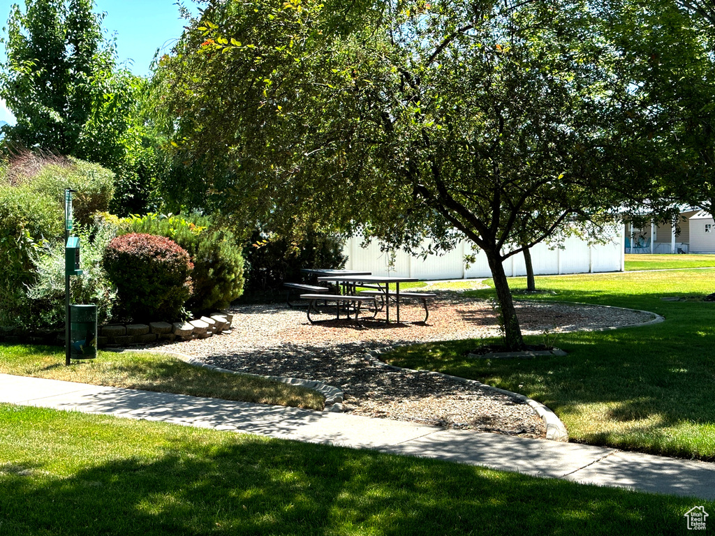 View of property's community featuring a lawn