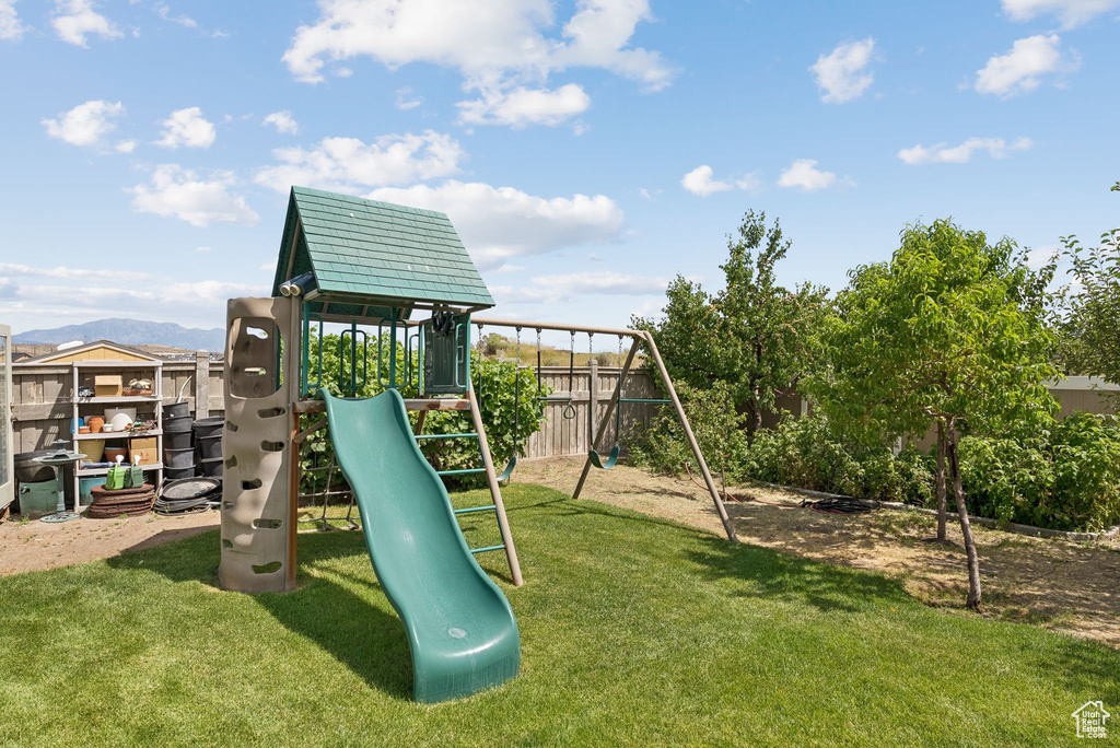 View of play area with a lawn