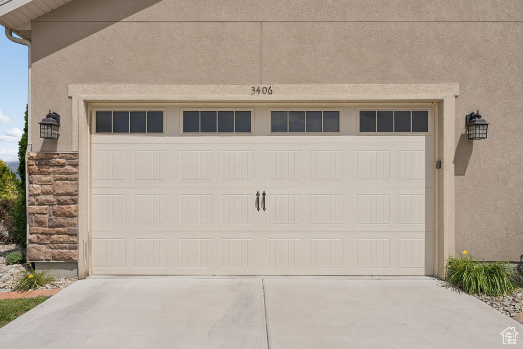 Garage featuring driveway