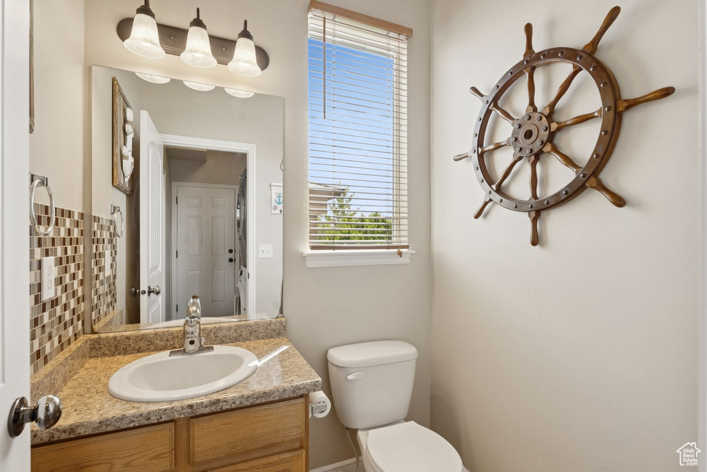 Bathroom featuring toilet and vanity