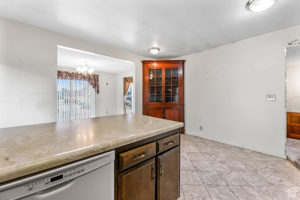 Kitchen with dishwashing machine and a chandelier