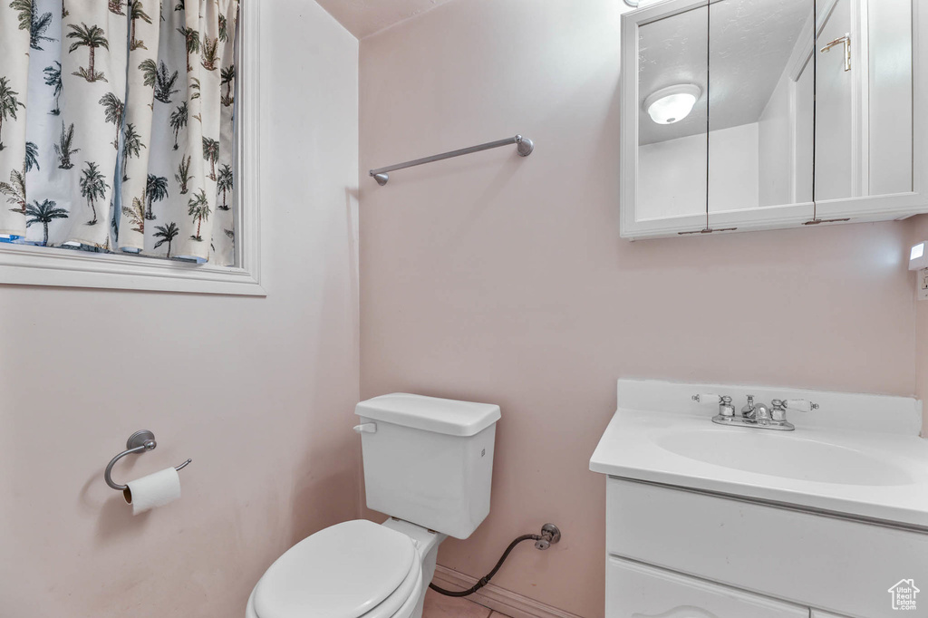 Bathroom featuring vanity and tile patterned floors