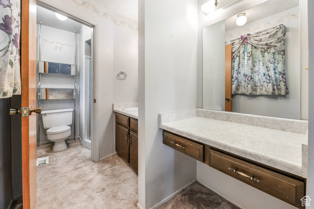Full bathroom featuring vanity and toilet