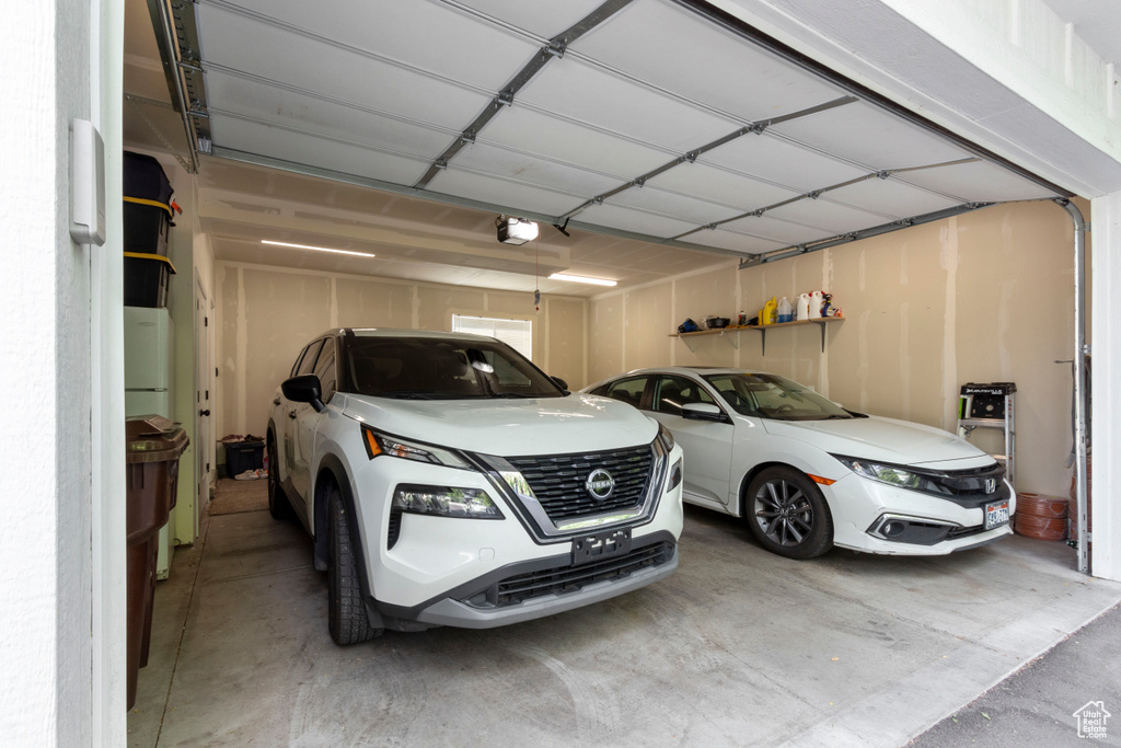 Garage featuring a garage door opener
