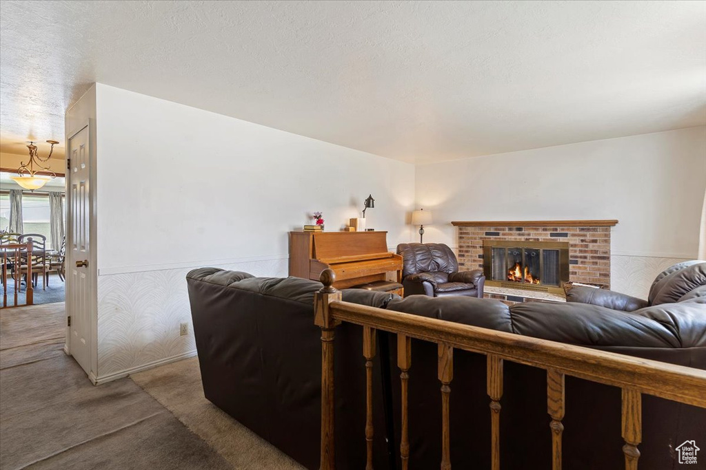 Carpeted living room with a fireplace