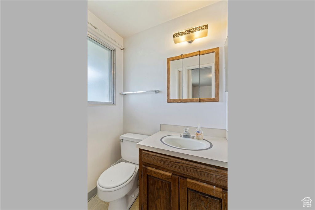 Bathroom featuring vanity and toilet