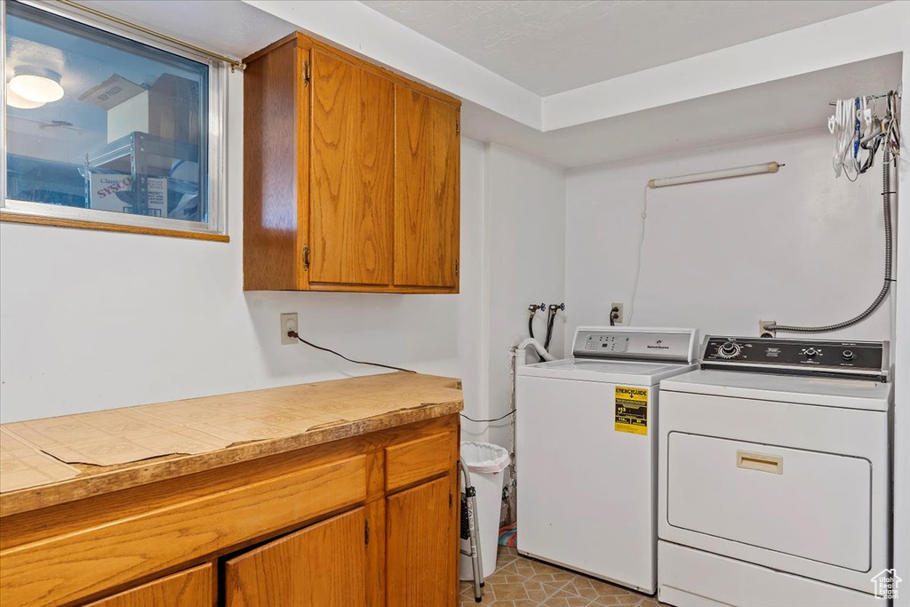 Laundry area with cabinet space and washer and dryer
