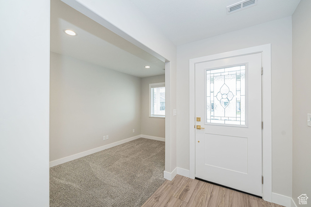 Foyer with recessed lighting and light wood-type flooring