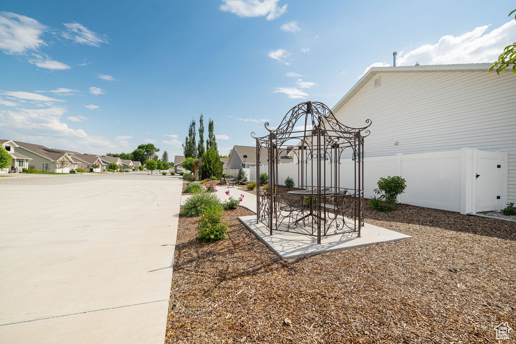 View of yard with a residential view and a patio