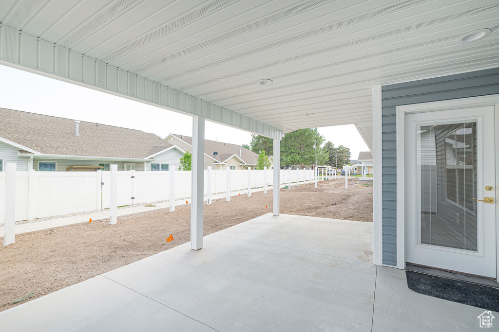 Fenced backyard featuring a patio