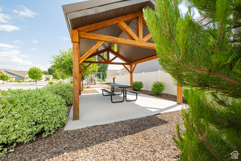 Surrounding community featuring a gazebo, a playground, and a patio area