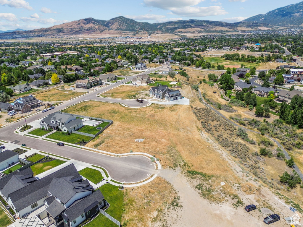 Aerial view of residential area featuring a mountainous background