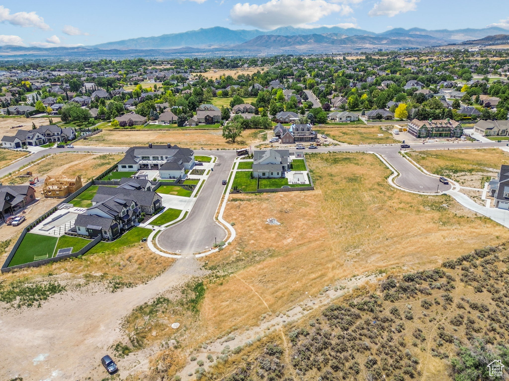Aerial perspective of suburban area with a mountain backdrop