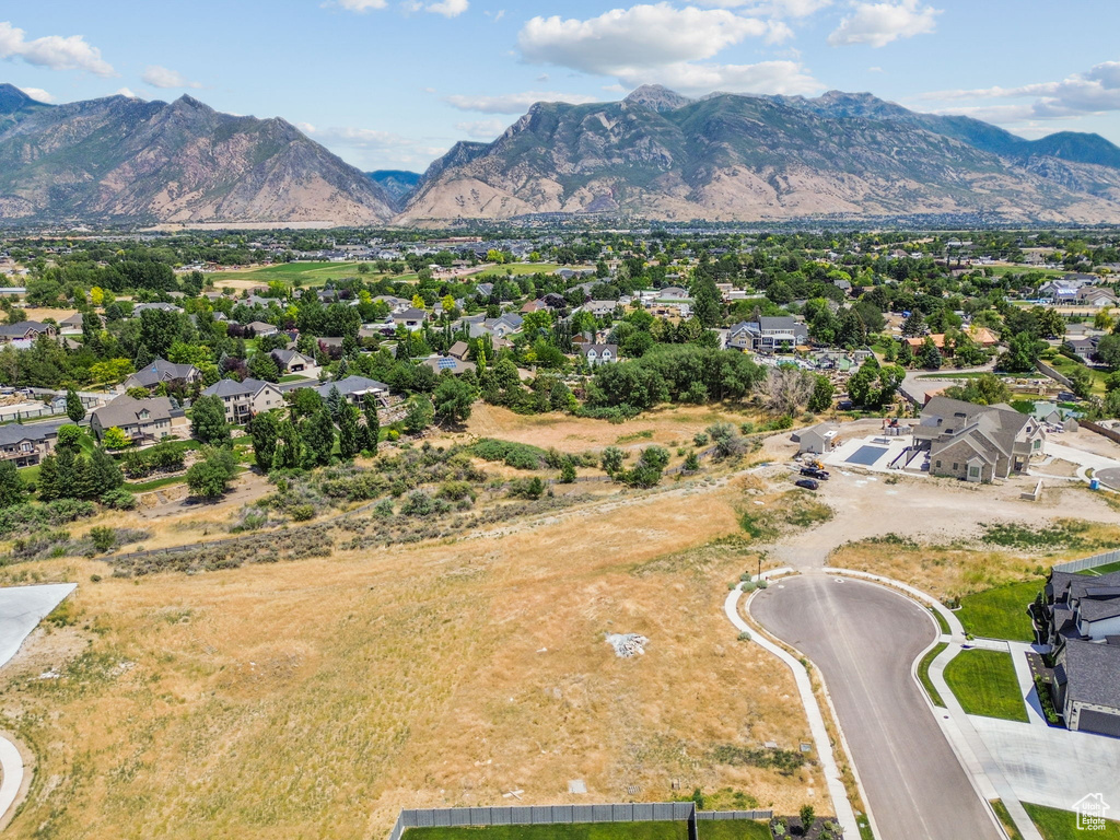 Aerial view of residential area featuring a mountainous background