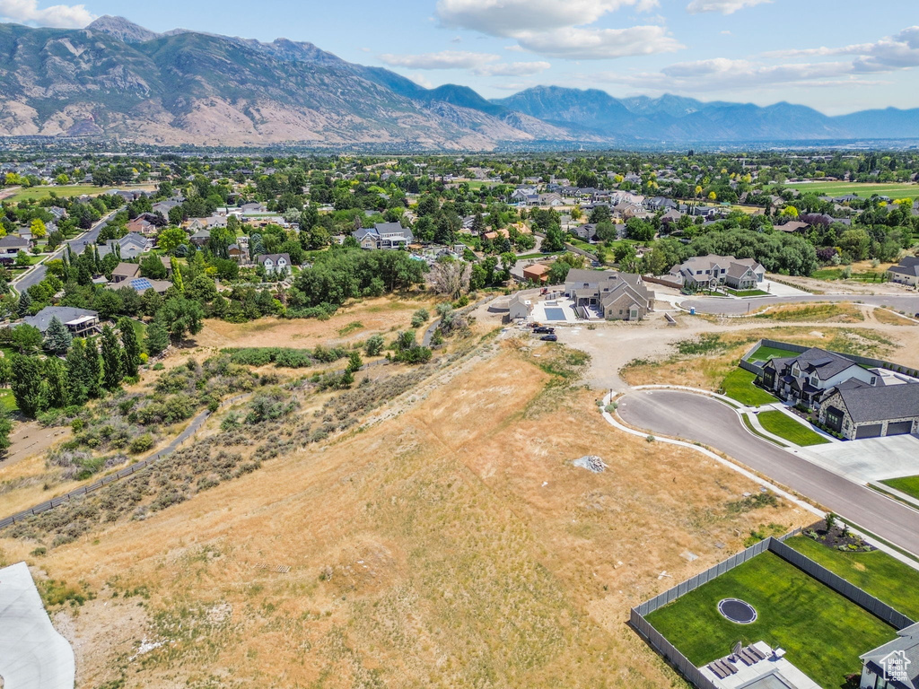 Aerial view of residential area with a mountainous background