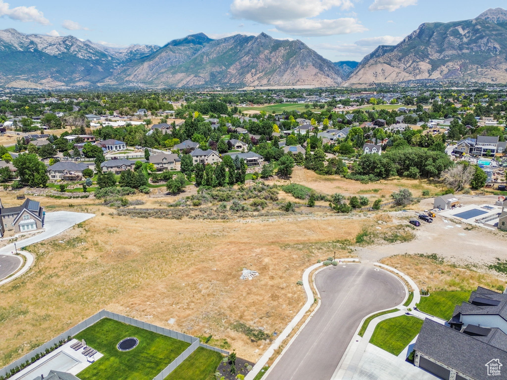 Aerial perspective of suburban area with a mountainous background
