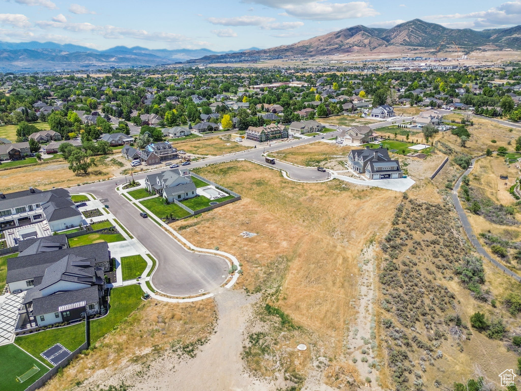 Aerial perspective of suburban area featuring a mountainous background