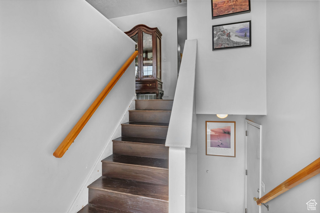Stairway featuring baseboards