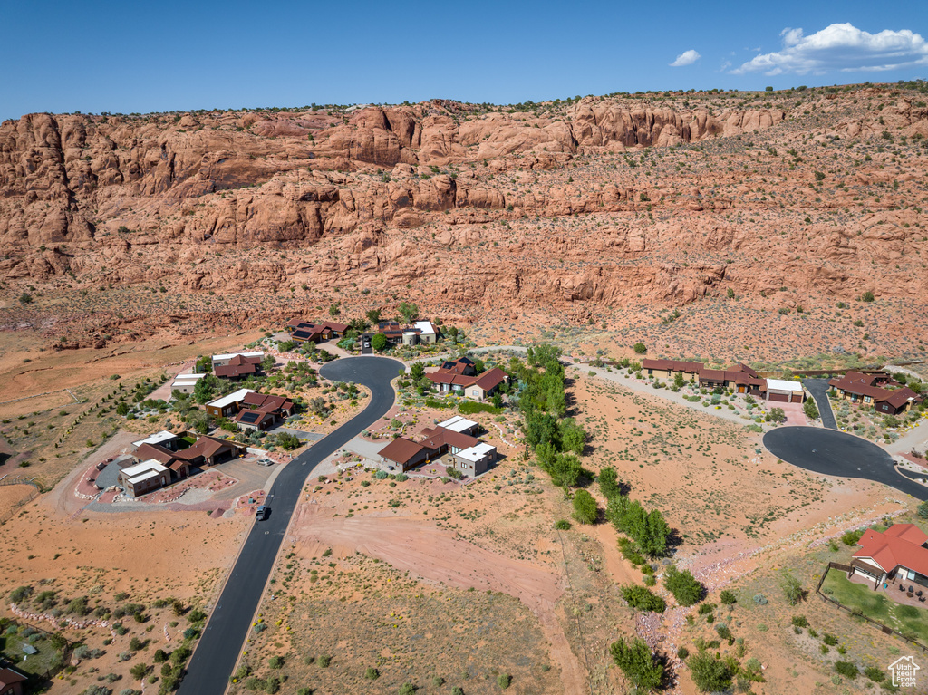 Aerial view of property and surrounding area with a mountain backdrop and rural landscape