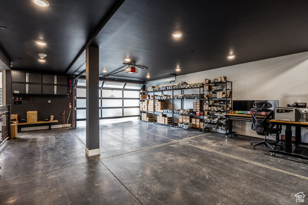 Garage featuring baseboards
