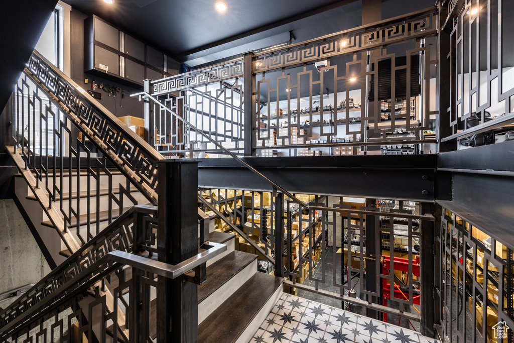 Staircase featuring tile patterned floors and a city view