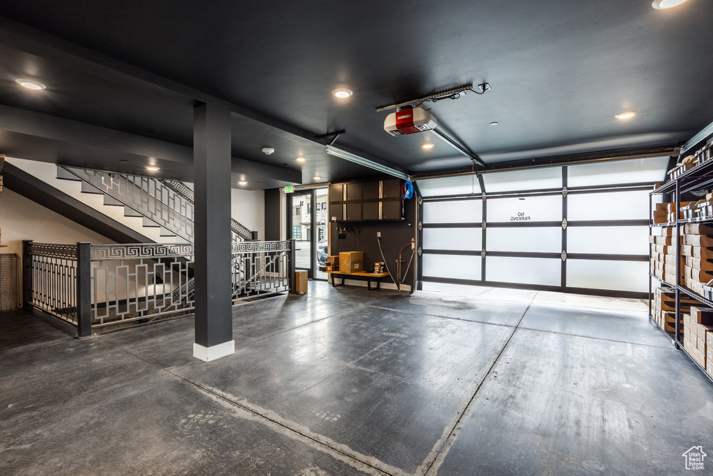 Garage with a garage door opener and recessed lighting