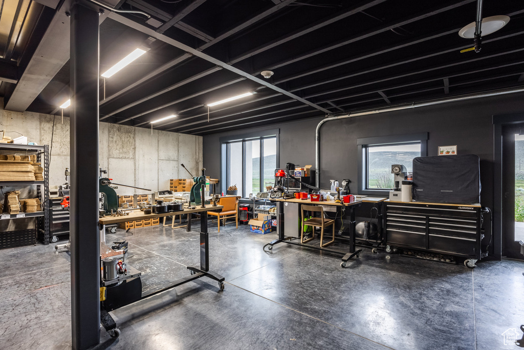 Basement featuring a workshop area and healthy amount of natural light
