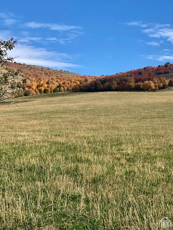 View of mountain background featuring rural landscape