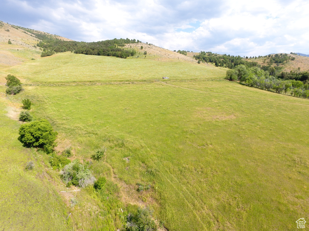 Overview of rural landscape featuring a mountainous background