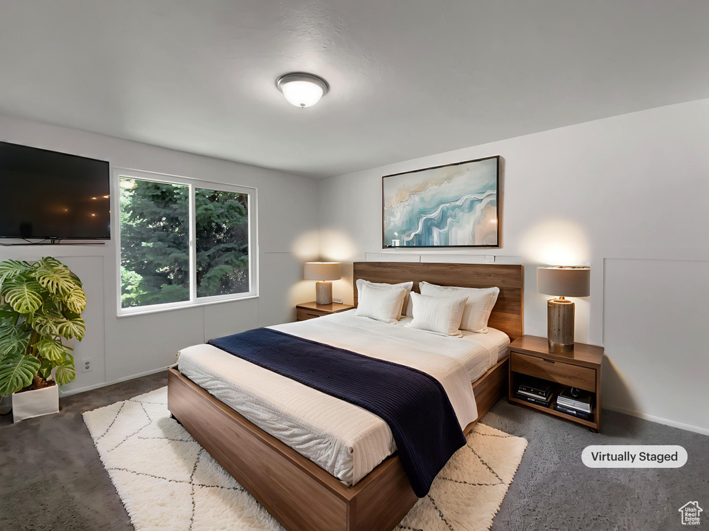 Bedroom with carpet floors and baseboards