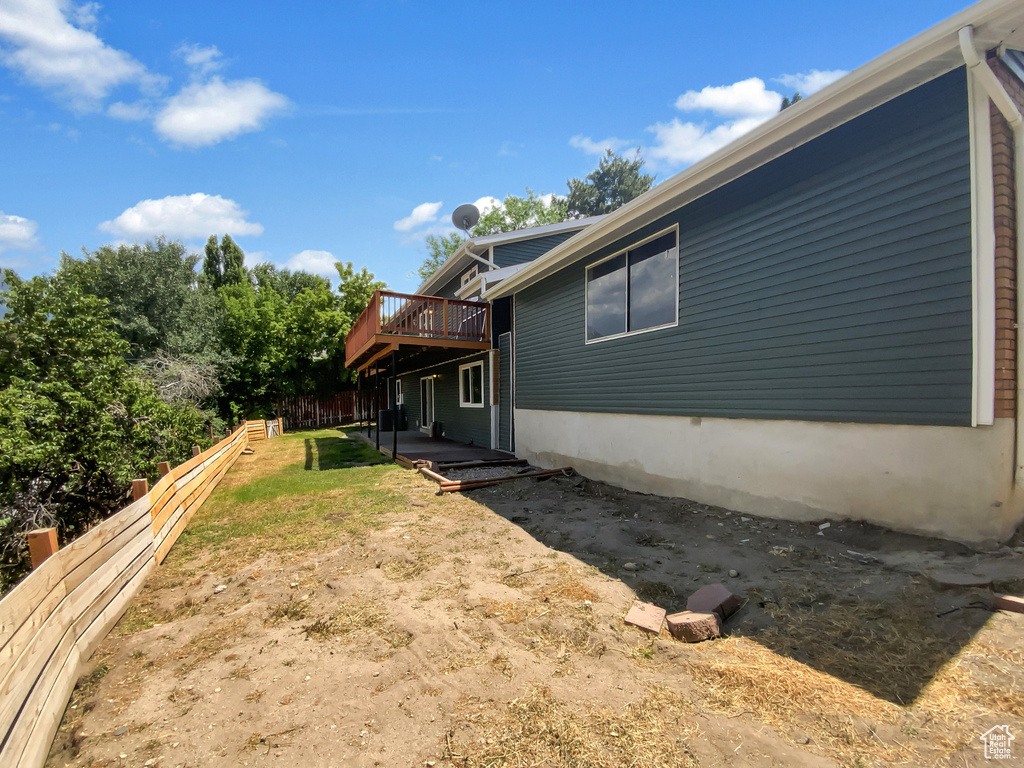 View of yard with a deck