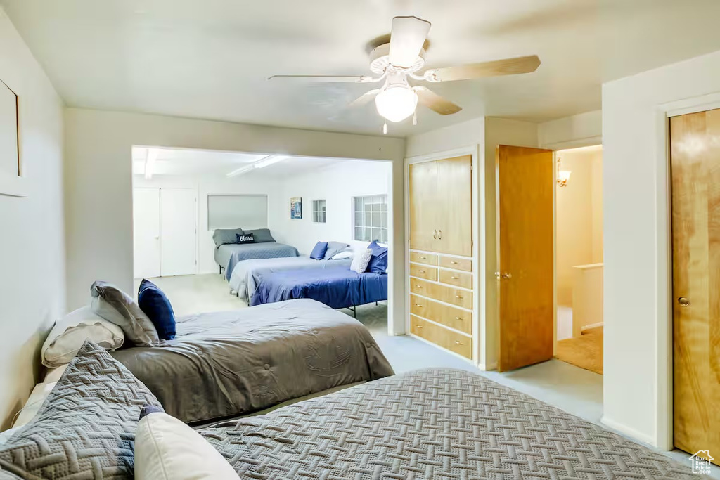 Bedroom featuring carpet and ceiling fan