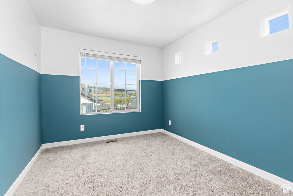 Unfurnished room with carpet floors