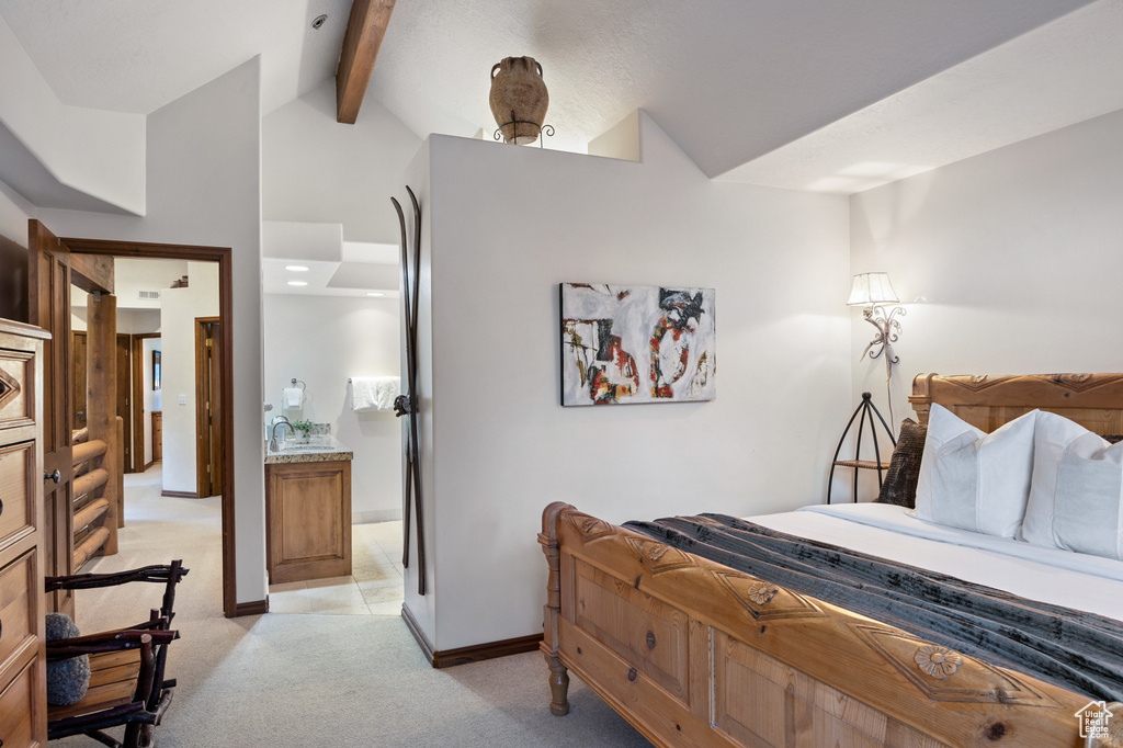 Bedroom featuring light colored carpet and baseboards