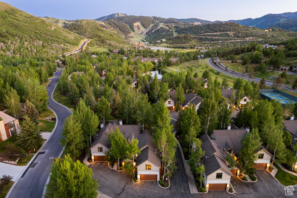 Aerial view of residential area featuring a mountainous background
