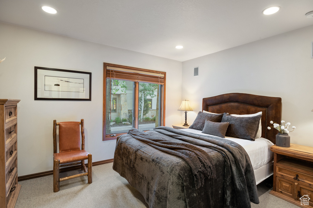 Bedroom featuring light colored carpet and recessed lighting