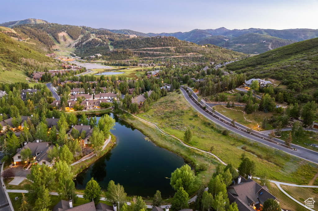 Aerial overview of property's location with a water and mountain view