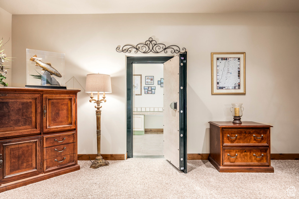 Bedroom featuring carpet floors and ensuite bath