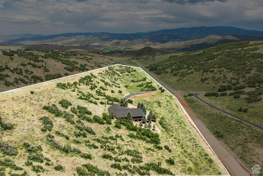 View of rural area with a mountain backdrop and property boundaries highlighted