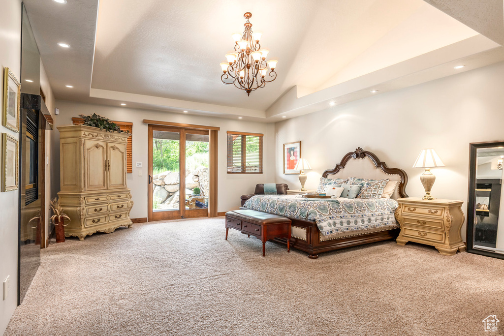 Bedroom with light colored carpet, access to outside, recessed lighting, lofted ceiling, and a chandelier