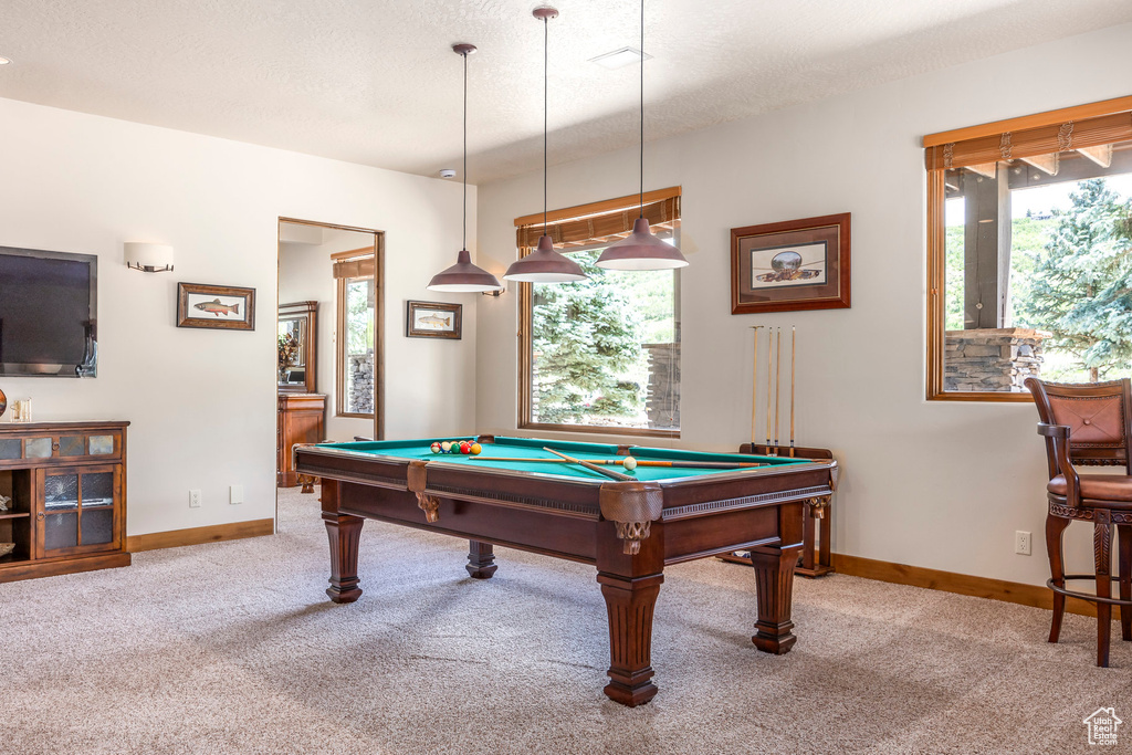 Game room with carpet floors, billiards table, and plenty of natural light