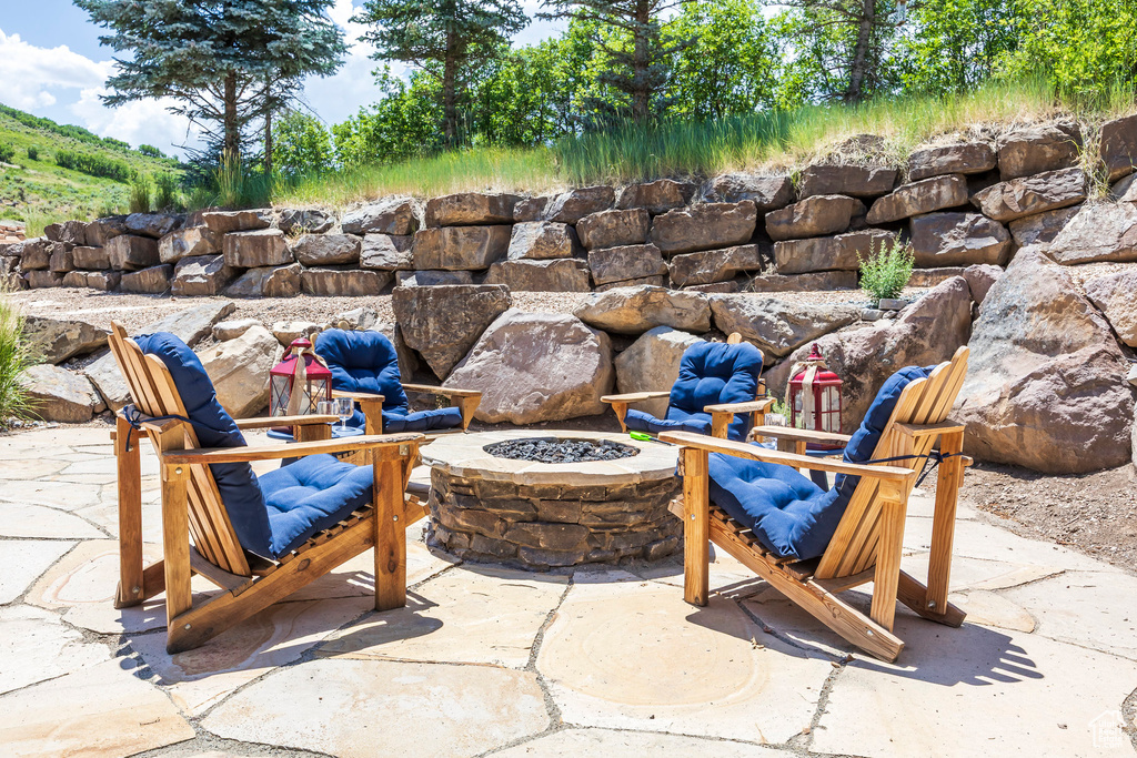 View of patio / terrace with a fire pit