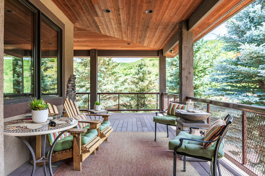 Sunroom featuring lofted ceiling