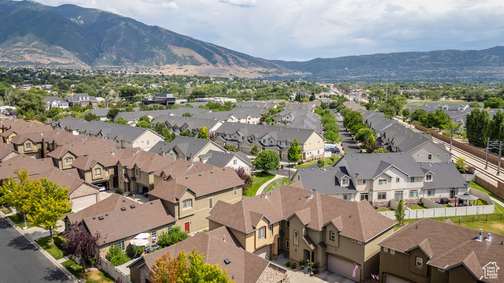Aerial perspective of suburban area with a mountainous background